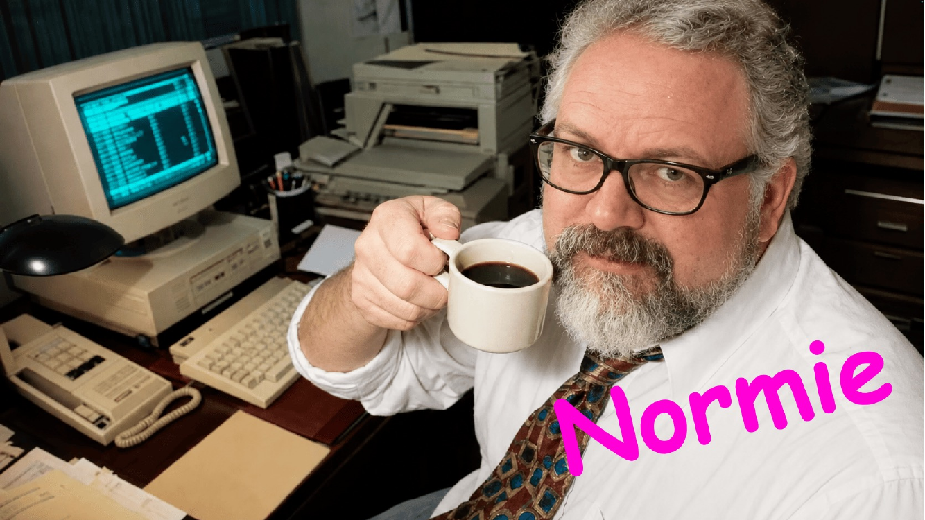 Cot&eacute; at a 1990s office desk with a beige computer, holding up a cup of coffee, labeled 'Normie' in pink.